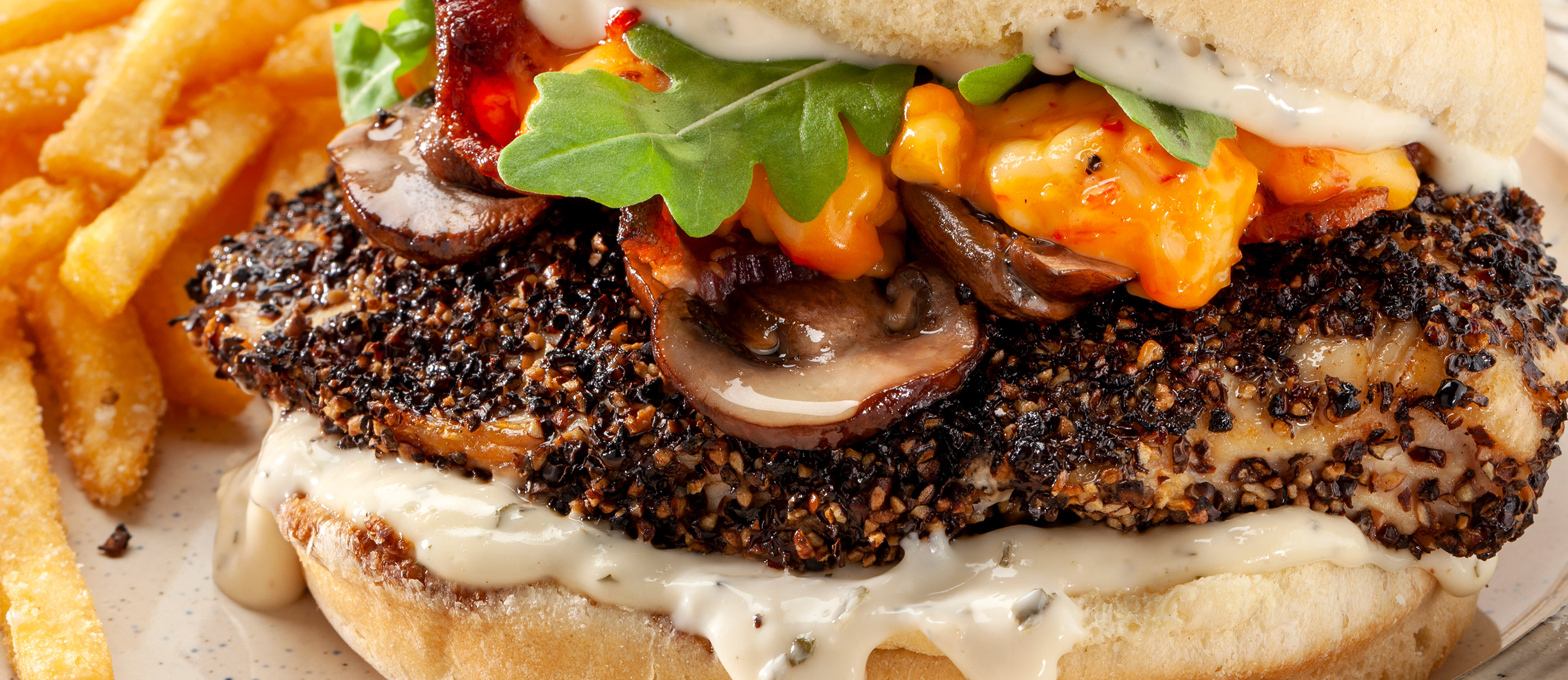 Cracked Peppercorn Crusted Chicken Sandwich with Dill Pickle Aioli